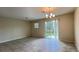 Spacious living room with tile flooring, slider to patio and backyard views at 4634 Tribute Trl, Kissimmee, FL 34746