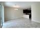 Open living room featuring tile floors and view to the kitchen at 4634 Tribute Trl, Kissimmee, FL 34746