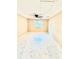 Attic space has a ceiling fan, window, and tile flooring at 4917 Easton St, Lake Wales, FL 33859