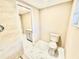 Beautifully updated bathroom with new fixtures, tile flooring, walk-in shower, and modern toilet at 4917 Easton St, Lake Wales, FL 33859