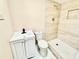 Updated bathroom with modern vanity, walk-in shower with neutral tile, and matching toilet at 4917 Easton St, Lake Wales, FL 33859