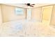 Bright and airy bedroom featuring new windows, ceiling fan and modern marble-patterned tile flooring at 4917 Easton St, Lake Wales, FL 33859
