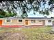 Charming single-story home featuring a brick and siding facade and manicured red mulch landscaping at 4917 Easton St, Lake Wales, FL 33859