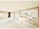 Bright living space with open layout, white cabinets, breakfast bar and modern marble-patterned tile flooring at 4917 Easton St, Lake Wales, FL 33859