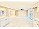 Spacious open-concept living area boasts new tile flooring and opens to the kitchen and front entrance at 4917 Easton St, Lake Wales, FL 33859