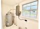 Utility Room shows water heater and window at 4917 Easton St, Lake Wales, FL 33859