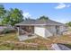The backyard offers a fire pit area, a shed and a nice grassy area for outdoor enjoyment at 511 Mobley Dr, Deltona, FL 32725