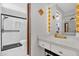 Updated bathroom featuring a stand-up shower with black hardware and modern fixtures at 511 Mobley Dr, Deltona, FL 32725
