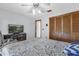 Comfortable bedroom with wood-look floors, a ceiling fan, and spacious closet at 511 Mobley Dr, Deltona, FL 32725