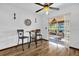 Cozy dining area with a ceiling fan and sliding glass doors to a screened patio at 511 Mobley Dr, Deltona, FL 32725