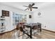 Bright dining room with wood floors and a bay window offers a cozy space for Gathering meals at 511 Mobley Dr, Deltona, FL 32725