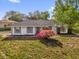 Charming single-story home with well-maintained lawn and mature landscaping, enhancing its curb appeal at 511 Mobley Dr, Deltona, FL 32725