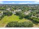 Large, well-maintained grassy lot surrounded by lush trees in a peaceful neighborhood, ideal for building a dream home at 5312 Kingswood Dr, Orlando, FL 32810
