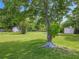 Backyard view with mature tree providing shade at 5312 Kingswood Dr, Orlando, FL 32810