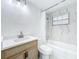 This bathroom features modern fixtures, vanity, shower/tub with tile surround and glass door at 5312 Kingswood Dr, Orlando, FL 32810