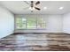 Bright bedroom with durable wood floors and large window offering a pleasant view at 5312 Kingswood Dr, Orlando, FL 32810