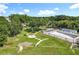 Aerial view of a community park with walking paths, lush landscaping, and mature trees at 5312 Kingswood Dr, Orlando, FL 32810