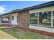Charming home featuring a mix of brick and siding, complemented by large windows and a well-manicured lawn at 5312 Kingswood Dr, Orlando, FL 32810