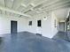 Wide view of the home's exterior with a spacious covered area and light blue flooring at 5312 Kingswood Dr, Orlando, FL 32810
