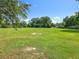 Large, well-maintained grassy lot providing ample space, opportunity and sunshine for a custom build or recreational use at 5312 Kingswood Dr, Orlando, FL 32810
