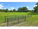 Well-maintained grassy lot with a fence border, ready for new construction, recreation, or creating a custom backyard paradise at 5312 Kingswood Dr, Orlando, FL 32810