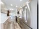 Bright kitchen featuring wood cabinets, quartz countertops, and stainless steel appliances at 5312 Kingswood Dr, Orlando, FL 32810