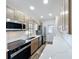 Updated kitchen featuring stainless appliances, light wood cabinets, and marble countertops at 5312 Kingswood Dr, Orlando, FL 32810