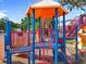 Bright and colorful playground featuring slides, climbing structures, and a covered play area for hours of fun at 5312 Kingswood Dr, Orlando, FL 32810