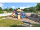 Vibrant community playground with slides, climbing structures, and a bench, perfect for Gathering fun and recreation at 5312 Kingswood Dr, Orlando, FL 32810