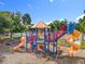 Community playground features a slide and other activities for to enjoy at 5312 Kingswood Dr, Orlando, FL 32810