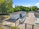 Outdoor pool area featuring a pool house, fenced-in for privacy, and ample seating at 5312 Kingswood Dr, Orlando, FL 32810