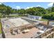 Pool deck with outdoor seating, a community pool, a patio, and beautiful landscaping at 5312 Kingswood Dr, Orlando, FL 32810