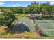 Community amenities featuring a basketball court and tennis court surrounded by mature trees at 5312 Kingswood Dr, Orlando, FL 32810