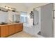Large bathroom with a tub, a shower, and a vanity with plenty of counter space at 651 Regina Cir, Oakland, FL 34787