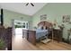 Spacious primary bedroom with a king bed and a sliding glass door leading to the backyard at 651 Regina Cir, Oakland, FL 34787