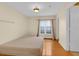 Clean and bright bedroom with hardwood floors, natural light, and comfortable Cloud Supreme mattress at 651 Regina Cir, Oakland, FL 34787