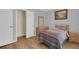 Bedroom featuring a cozy bed, wood dresser, and closet with a white door at 651 Regina Cir, Oakland, FL 34787