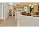 Elegant dining room with hardwood floors, decorative chandelier, and a glimpse into the living area at 651 Regina Cir, Oakland, FL 34787
