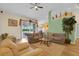 Inviting living room with lots of light, hardwood floors, comfortable sofas, and sliding doors at 651 Regina Cir, Oakland, FL 34787