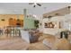 Open-concept living room featuring hardwood floors and seamless transition to dining and kitchen at 651 Regina Cir, Oakland, FL 34787