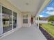 Covered patio with ample space and views of the backyard and neighboring homes at 651 Regina Cir, Oakland, FL 34787