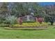 The John's Landing community entrance sign is well-landscaped, inviting, and shows pride of ownership at 651 Regina Cir, Oakland, FL 34787