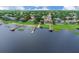 Stunning waterfront property featuring a private dock, boat lift, and serene lake views perfect for boating enthusiasts at 651 Regina Cir, Oakland, FL 34787