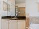 Bathroom featuring granite countertops, vanity mirror, glass shower, and bathtub at 6808 Goldflower Ave, Harmony, FL 34773