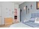 Comfortable bedroom with decorative swords on the wall and easy access to the game room at 6808 Goldflower Ave, Harmony, FL 34773
