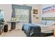 Bedroom with an electric piano, curtains, and sports decor at 6808 Goldflower Ave, Harmony, FL 34773