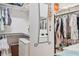 Bright walk-in closet featuring custom shelving, and ample storage space for clothes and accessories at 6808 Goldflower Ave, Harmony, FL 34773