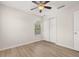 Bedroom featuring ceiling fan, closet, and new floors at 7638 Long Island Dr, Kissimmee, FL 34747