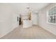 Open dining area with tile floors, a chandelier, and kitchen access at 7638 Long Island Dr, Kissimmee, FL 34747