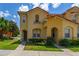 Charming townhome exterior with well-maintained landscaping and a welcoming entrance at 7638 Long Island Dr, Kissimmee, FL 34747
